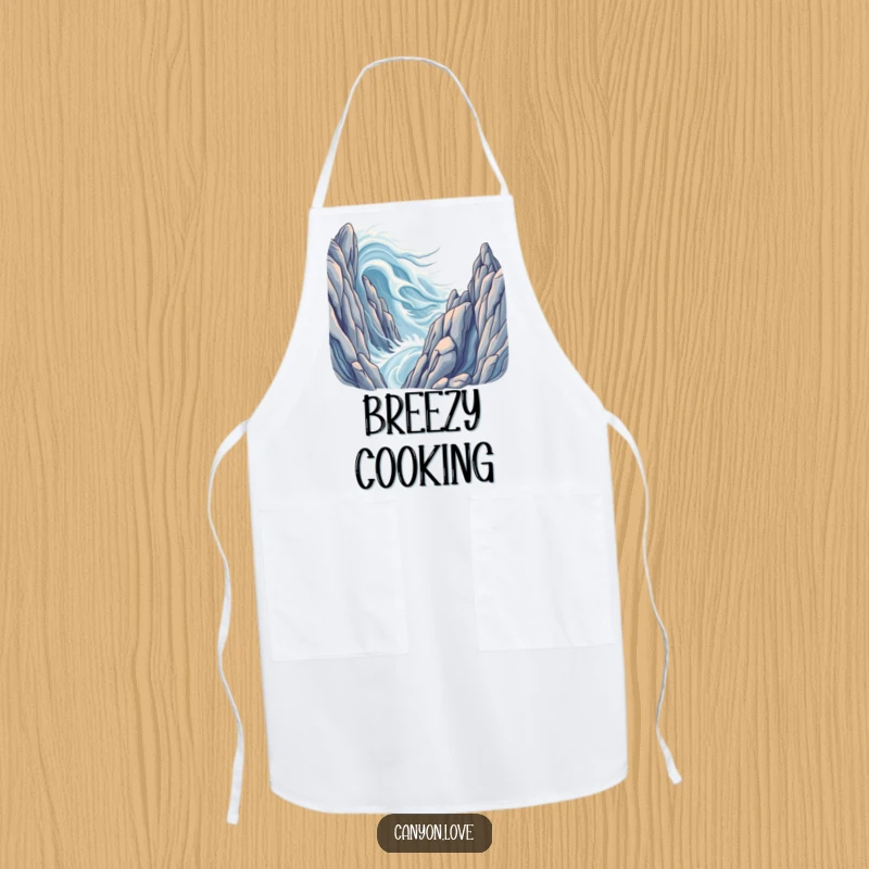 Funny apron illustrating fluid wind patterns flowing across majestic, stylized rock formations, ideal for chefs.