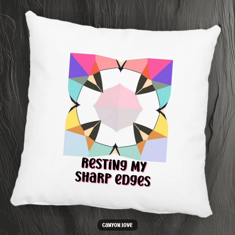 Funny Pillow decorated with jagged geometric shapes in contrasting bold colors, providing a comfortable and artistically inspired accent.