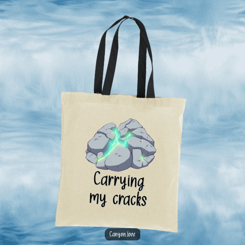 Funny tote bag illustrating a broken rock surface with vibrant, glowing veins visible within the fissures.